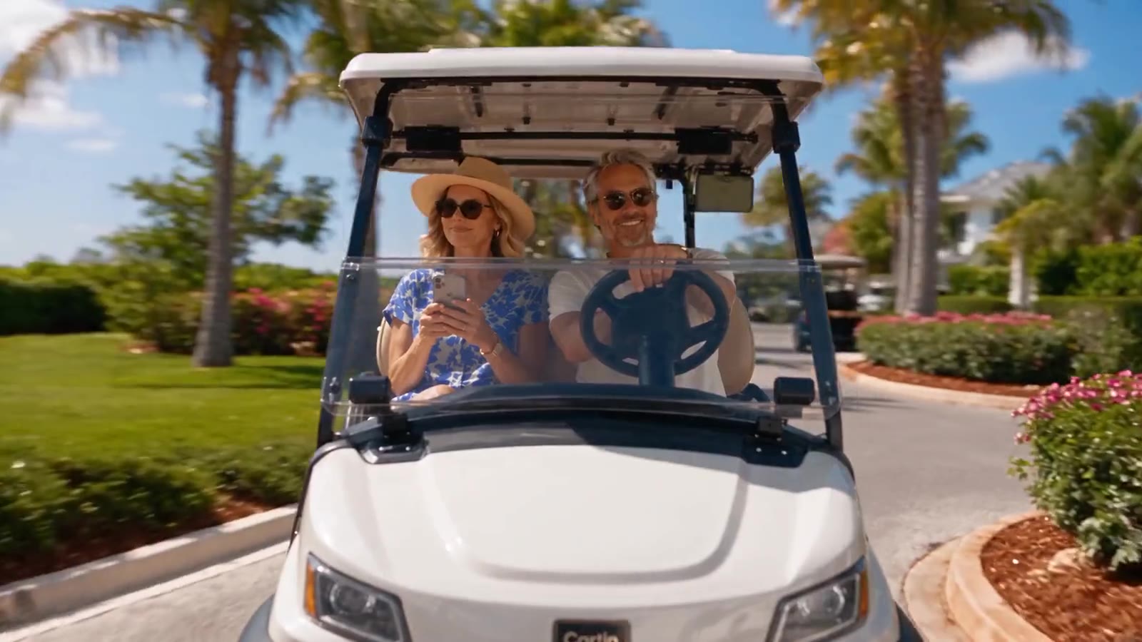 Friends cruising in a golf cart